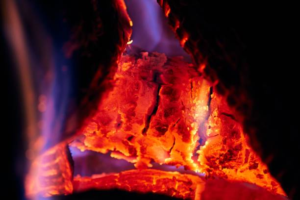 Burning bonfire with sparks on a dark background