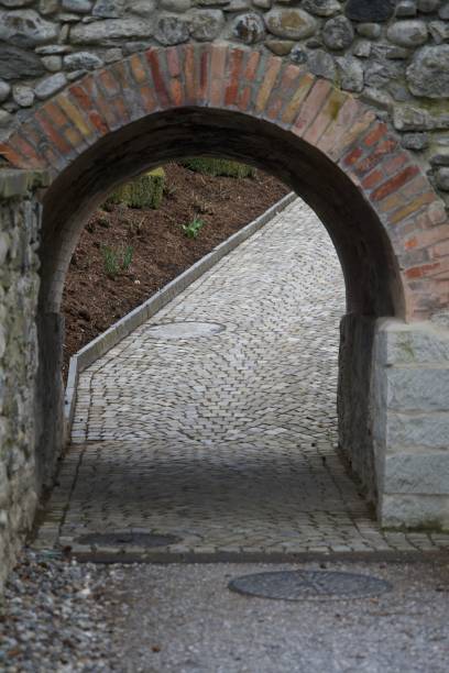 istock View of a road with a small stone arch in a park 1445654144