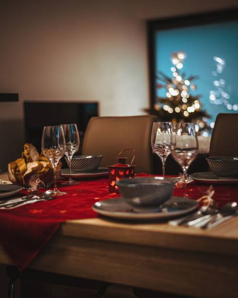istock Vertical view of a decorated Christmas family dinner table setting 1445654206