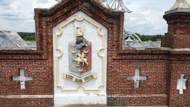istock Emblem on a red brick wall with Latin phrase Esse quam videri meaning To be, rather than to seem. 1445659310