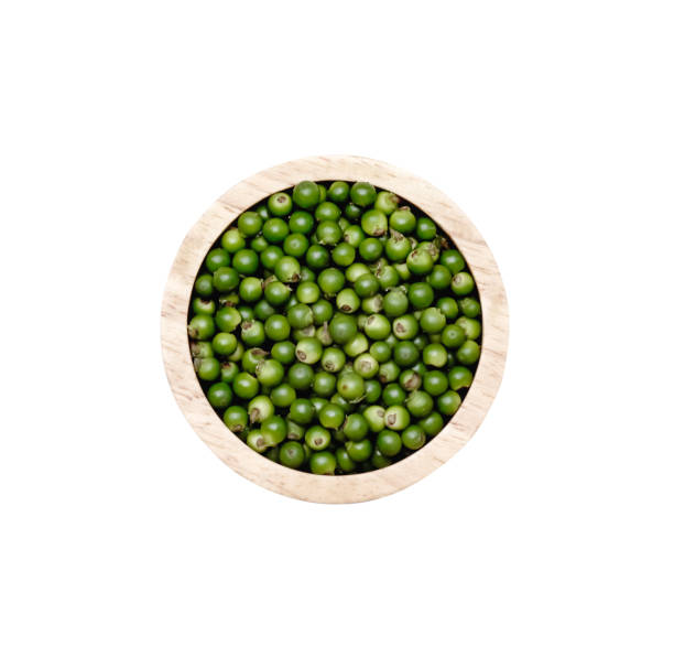 istock Piper nigrum (black pepper) in wood bowl isolated on white background , clipping path top view 1445661221