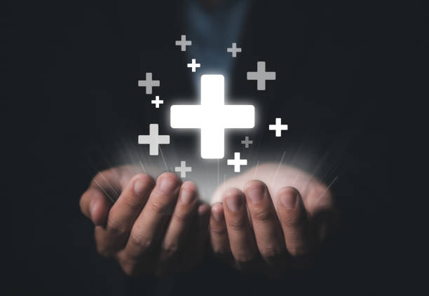 istock Hand showing medical plus sign. 1445665678
