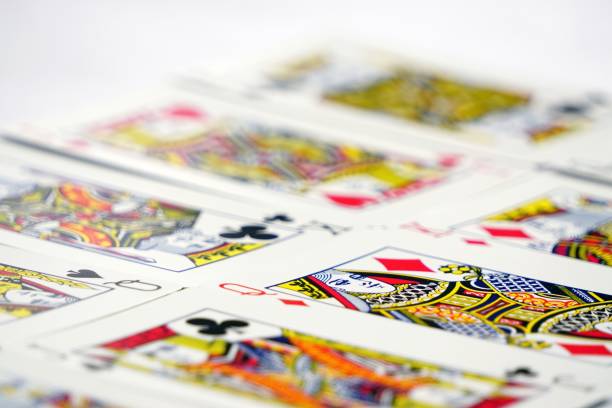 istock Close-up view of playing cards placed over the surface - game concept 1445665829
