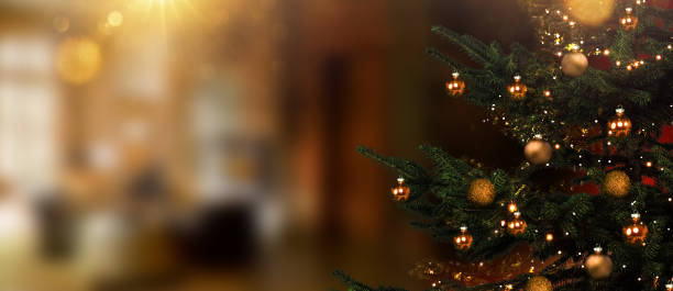 istock Christmas tree in foreground against blurred living room in background 1445667303