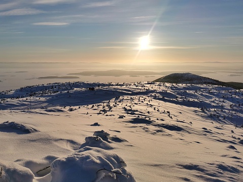 Winter sunny landscape on top of Volosyanaya mountain, Kandalaksha, Kola Peninsula. Tranquil nature scenery.