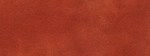 istock Texture of velvet matte dark orange background, macro. Suede ginger fabric with pattern. 1445668713