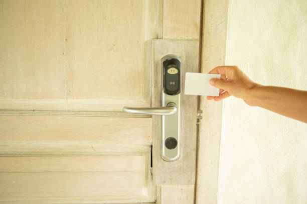 istock Closed up on woman's hand opening wireless lock with a key card 1445671003