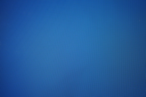 Blue LED Monitor Texture Background with Spotlight at the Center, Suitable for Technology and Business Concept.