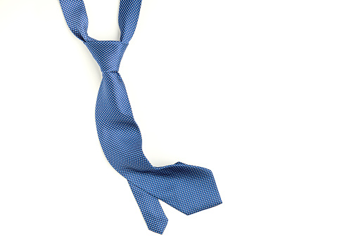 Father's Day composition of blue tie on a white background