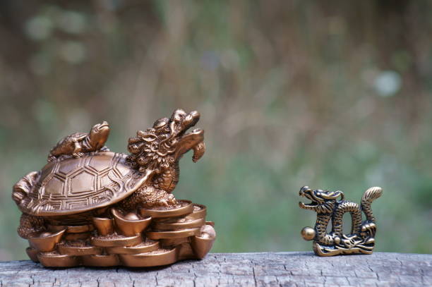 A dragon turtle and a small dragon figurine.
