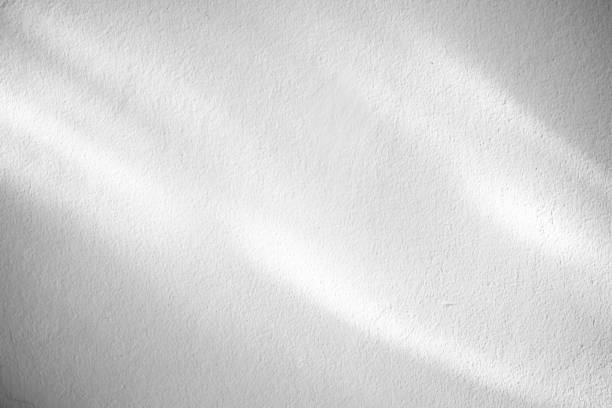 istock Reflected Light on White Concrete Wall Texture Background for Color Cast. 1445675893