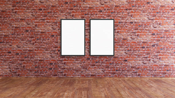 istock 2 vertical frame mockup on a red brick gallery wall with wooden floor 3d rendering. 1445676205