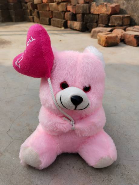 Pink Teddy Bear Plush Stuffed Puppet With Ribbon On White Backdrop