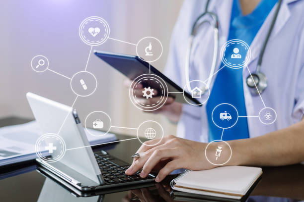 istock Medical technology concept. Doctor working with mobile phone and stethoscope and digital tablet laptop in modern office at hospital 1445679086
