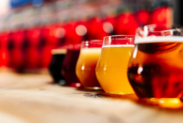 istock Glasses with different craft beer on wooden bar 1445679363