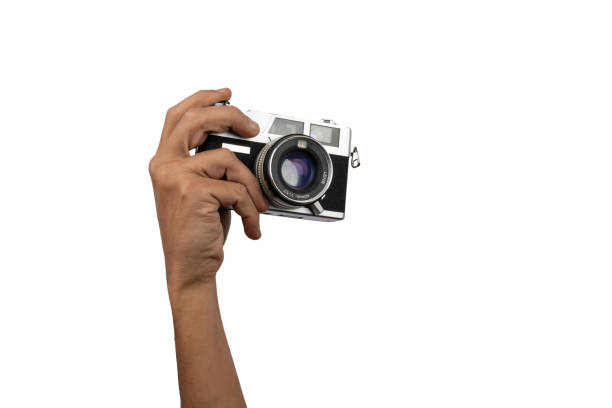 istock Male hand holding an old vintage camera on white background 1445680618