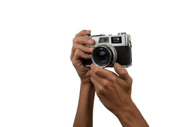 istock Male hands holding an old vintage camera on white background 1445680633