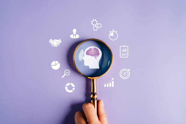 istock Magnifying glass focus to human brain with light bulb icon which for mind, creative, idea, innovation, motivation planning development leadership and customer target group concept. 1445681447