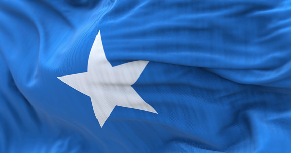 Close-up view of the Somalia national flag waving in the wind. Federal Republic of Somalia is a country in the Horn of Africa. Fabric textured background. Selective focus. 3d illustration