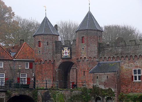The entrance of the medieval castle Het Steen (The Stone), in Antwerp, Belgium, showing the flags of Antwerp, EU and, Flanders and Belgium
