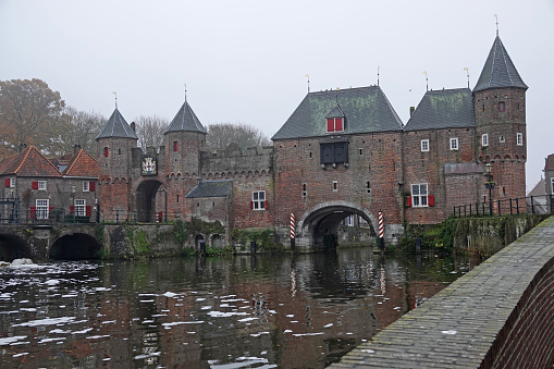 The Koppelpoort is a medieval gate in the Dutch city of Amersfoort. It combines land and water-gates. It's part of the second city wall and completed in 1425. The water in front is a sidearm the Eem