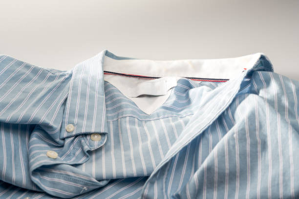 istock Partial closeup of a light blue striped shirt 1445685842