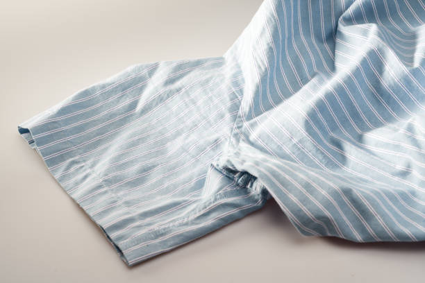 istock Partial closeup of a light blue striped shirt 1445685938