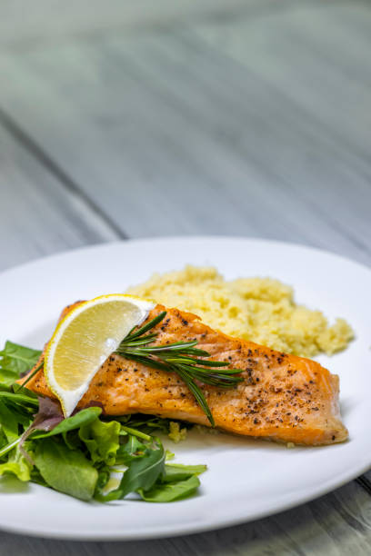 istock grilled salmon served with couscous and vegetables salad 1445686055