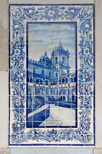 Old Portuguese Azulejo tile with the image of Claustro de D. Dinis of Alcobaca background