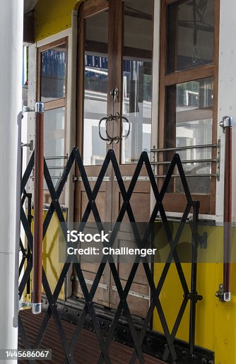 istock Entrance to the ancient yellow Portuguese tram with wooden door 1445686067
