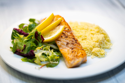 salmon fillet with couscous and vegetables salad