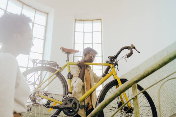 istock Student bringing his bike back to a dorm room 1445687752