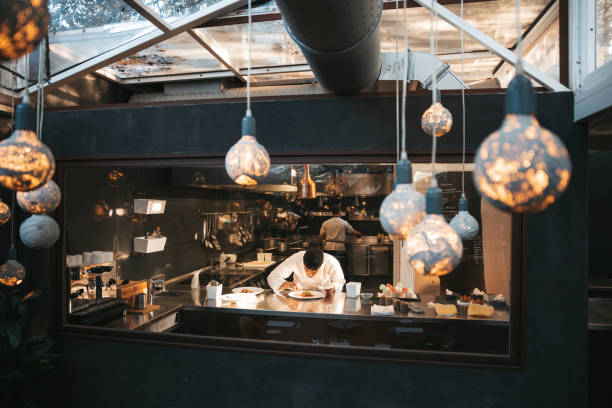 istock Chef preparing a plate in a gourmet restaurant 1445691382