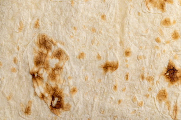 istock Wheat pita bread with dark spots 1445691722