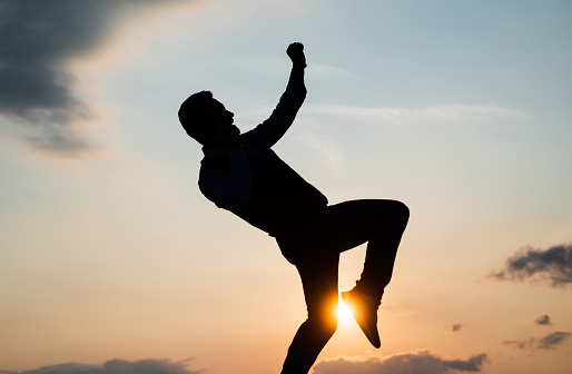making future bright. concept of future. free man dancing. happiness. need the inspiration. man feel motivation. full of energy. dancer silhouette on sky background. confidence and success.