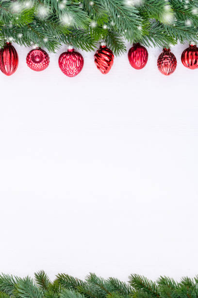 istock Red Glass Baubles with Christmas tree branches frame. 1445693275
