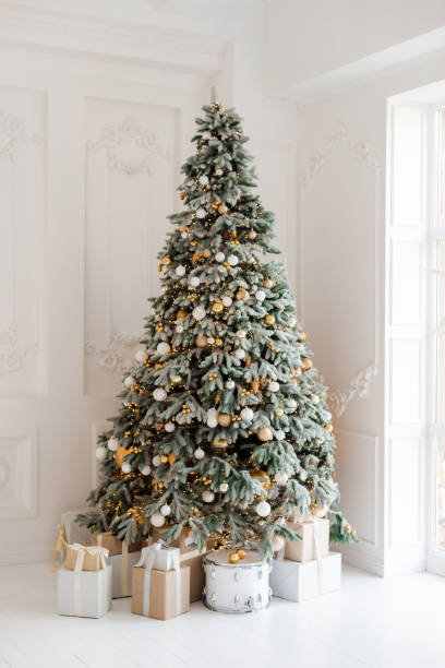 istock beautifully decorated room with a Christmas tree with gifts underneath. 1445693536