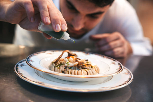 istock Chef preparing Fusilli pasta plate in a luxury restaurant 1445693757