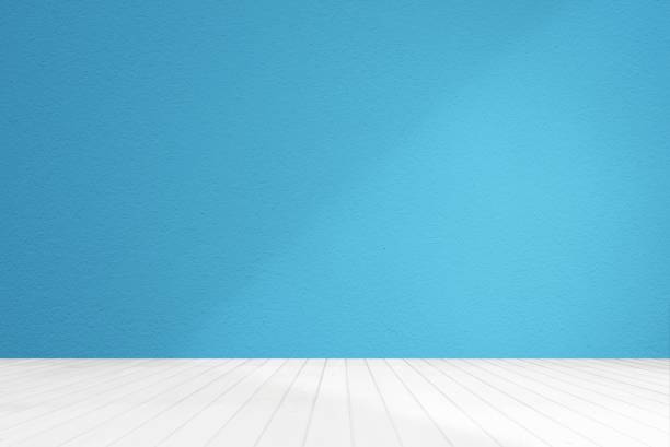 istock Abstract Blue Room with White Wooden Floor and Light Beam and Shadow on Wall. 1445694506