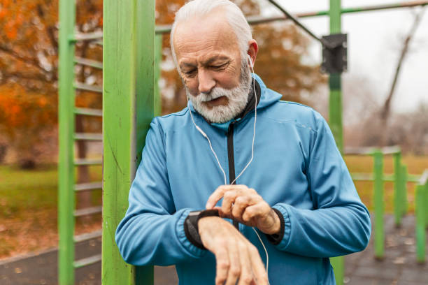 istock Senior man measuring activity on smart watch 1445694740