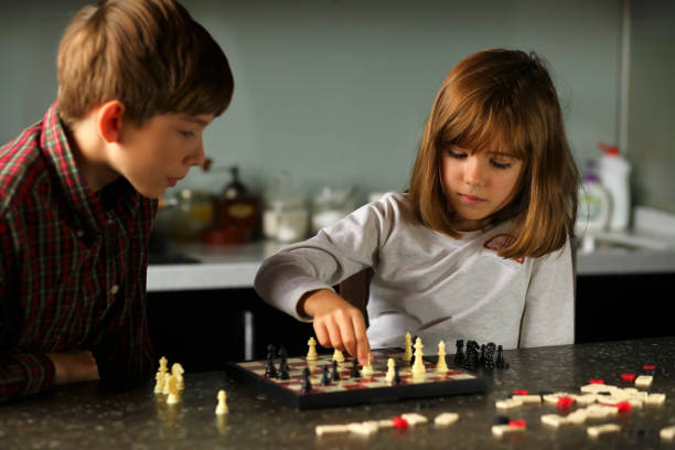 istock Children playing chess at home kitchen 1445695337