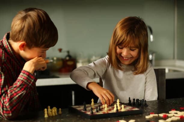 istock Children playing chess at home kitchen 1445695345