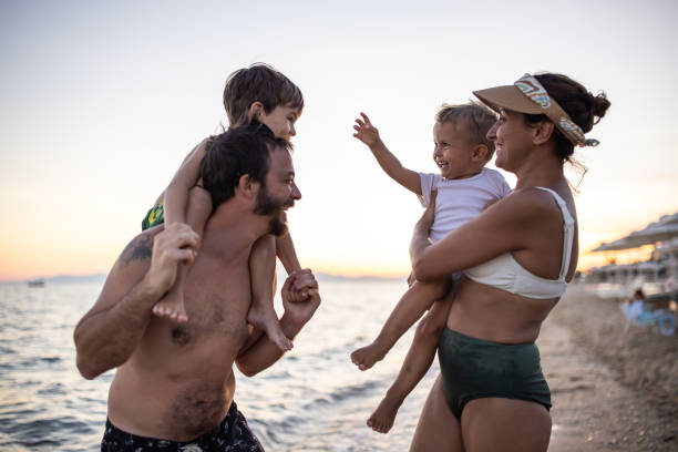 istock Family having fun together on a beach 1445696664