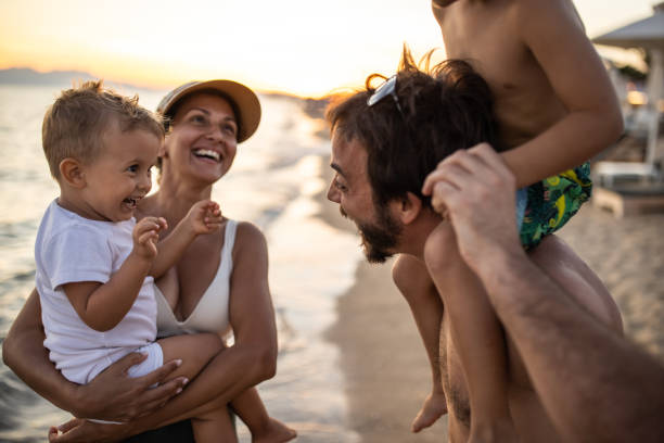 istock Family enjoying their time on the beach 1445696780