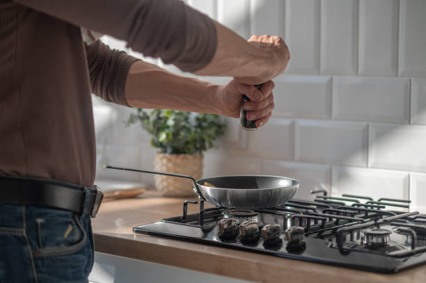 istock Man cooking something in the kitchen 1445698141