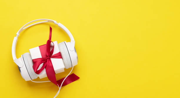 istock Headphones and gift box on yellow 1445699753