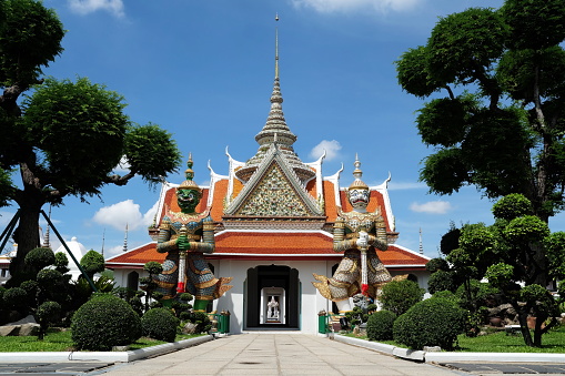 Ancient Guardian Giants in Front of Wat Arun Entrance. Wat Arun is famous temple and historical landmark of Thailand.