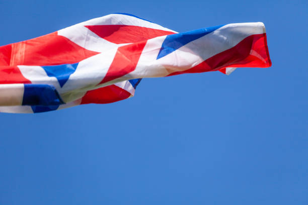 istock United Kingdom flag flying in wind 1445701996