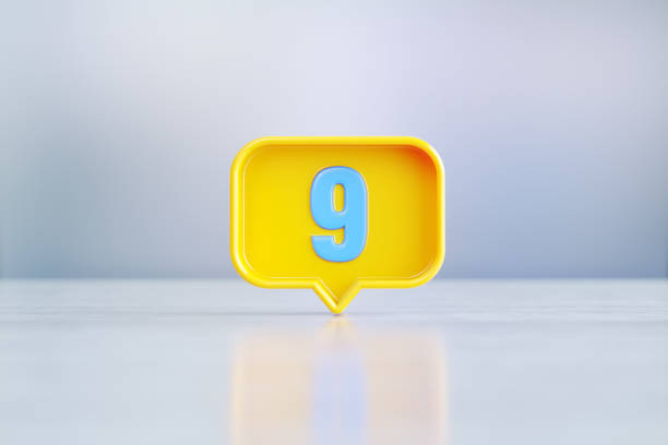 istock Yellow Speech Bubble Shape With Blue Number 9 Sitting Before Silver Defocused Background 1445702349