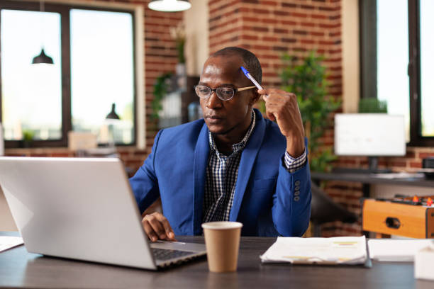 istock Business man thinking about innovative solution and planning project on laptop 1445703701